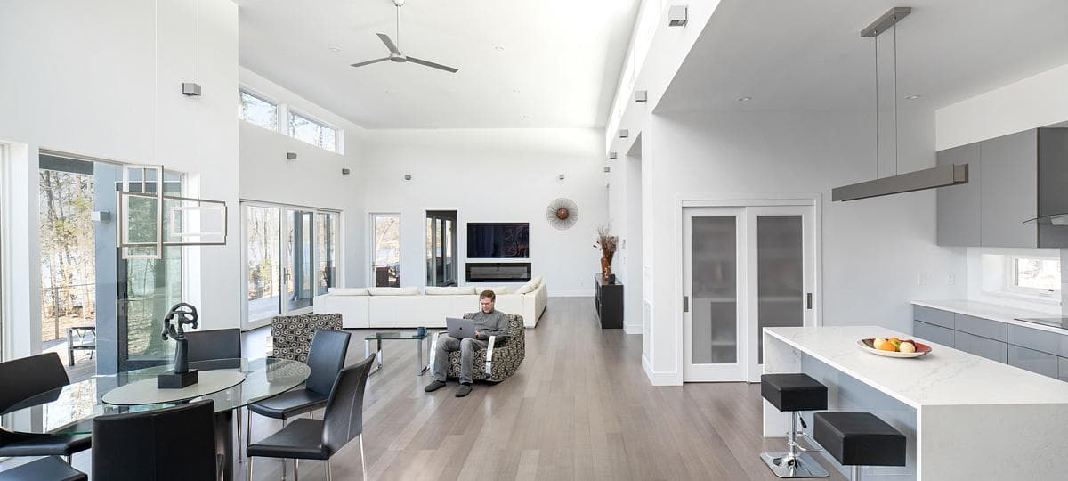Open living and dining space with clerestory glazing