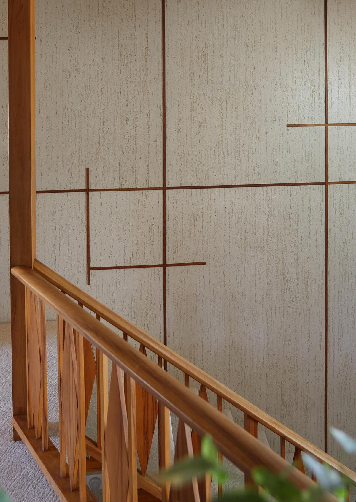 Wall panelling beside the timber stair.