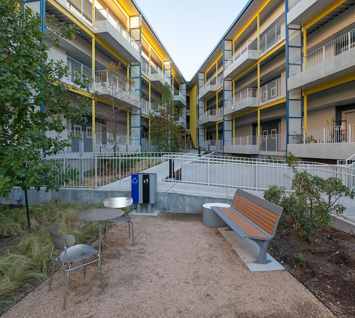 Terraced courtyard with seating, paths and shared circulation