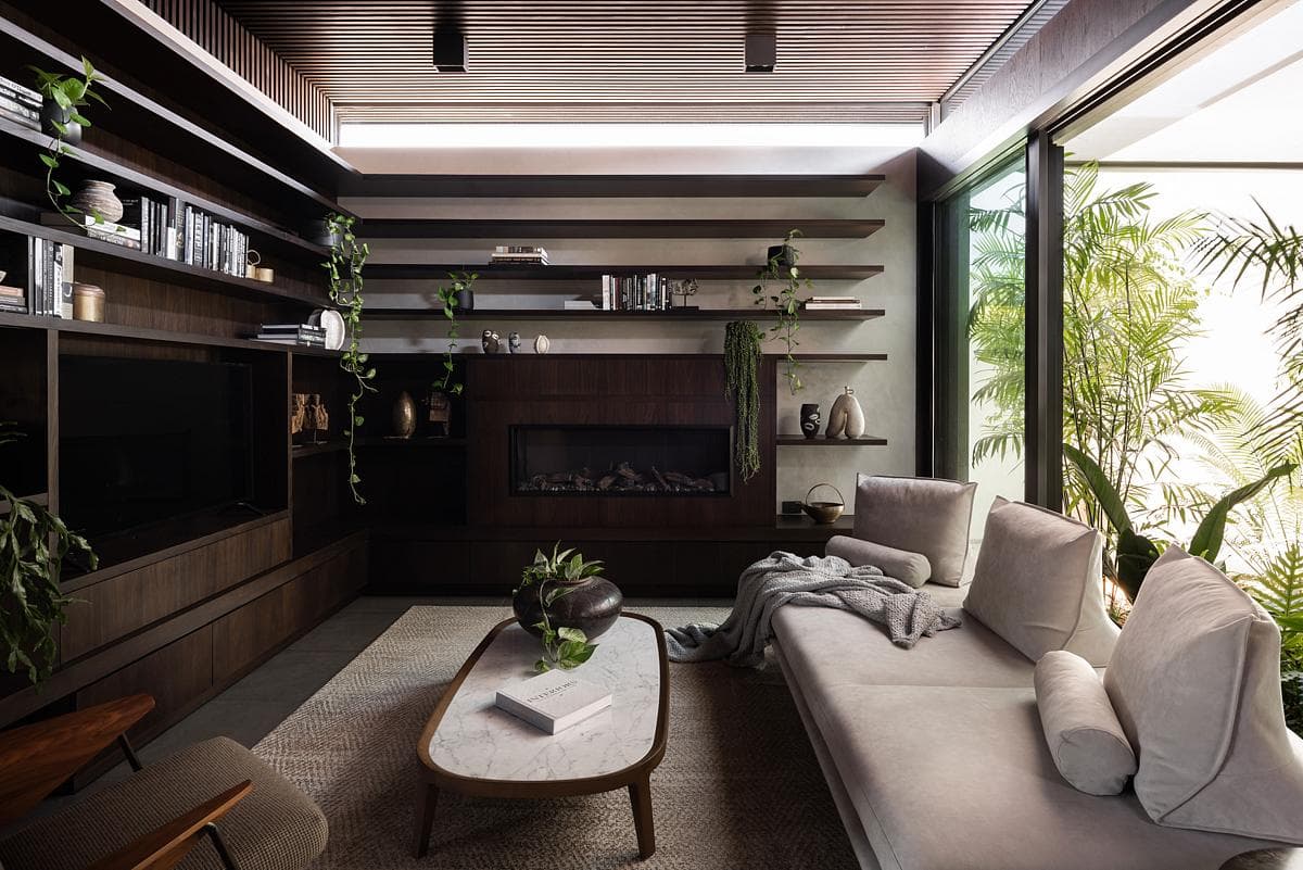 Living room opening towards a landscaped courtyard