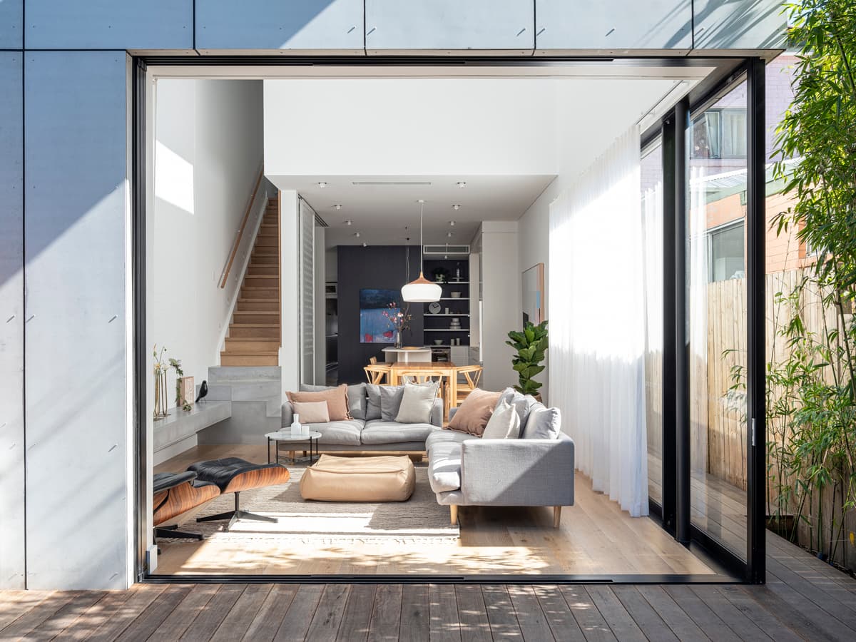 Large sliding doors connect the family living space with the garden terrace.