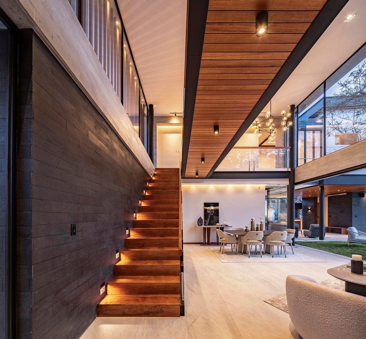 The stair and upper gallery connect the double-height living spaces.