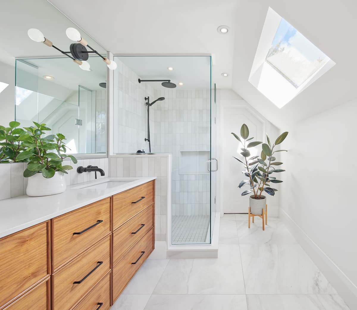 Timber cabinetry and a rooflight in the bathroom.