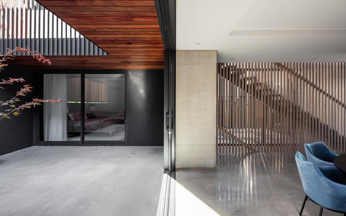 A sheltered outdoor space meets the timber-screened interior.