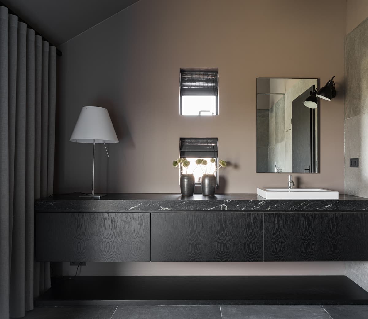 Dark joinery and twin basins in the bathroom.