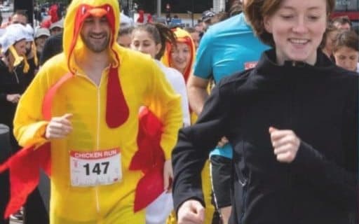 Fundraisers running the ABS Chicken Run in costume
