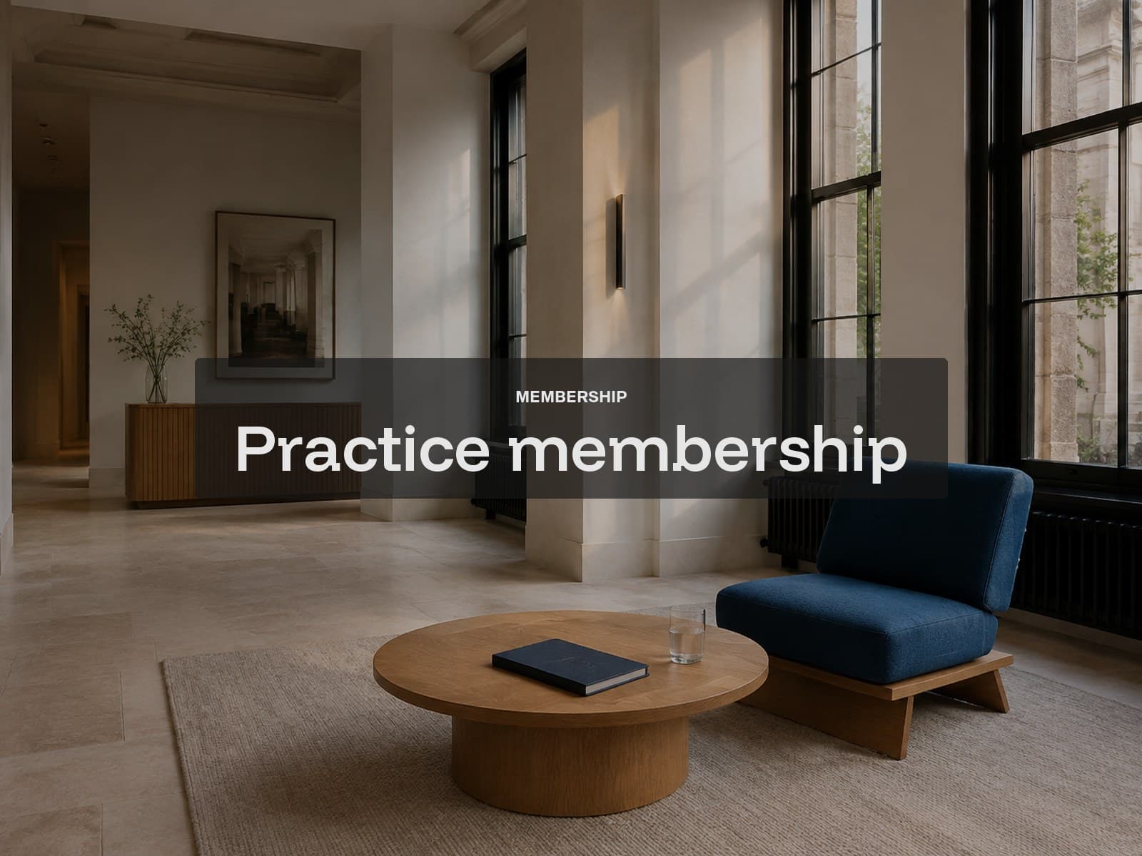 Practice membership cover: a quiet practice lobby with a blue chair and round oak table.