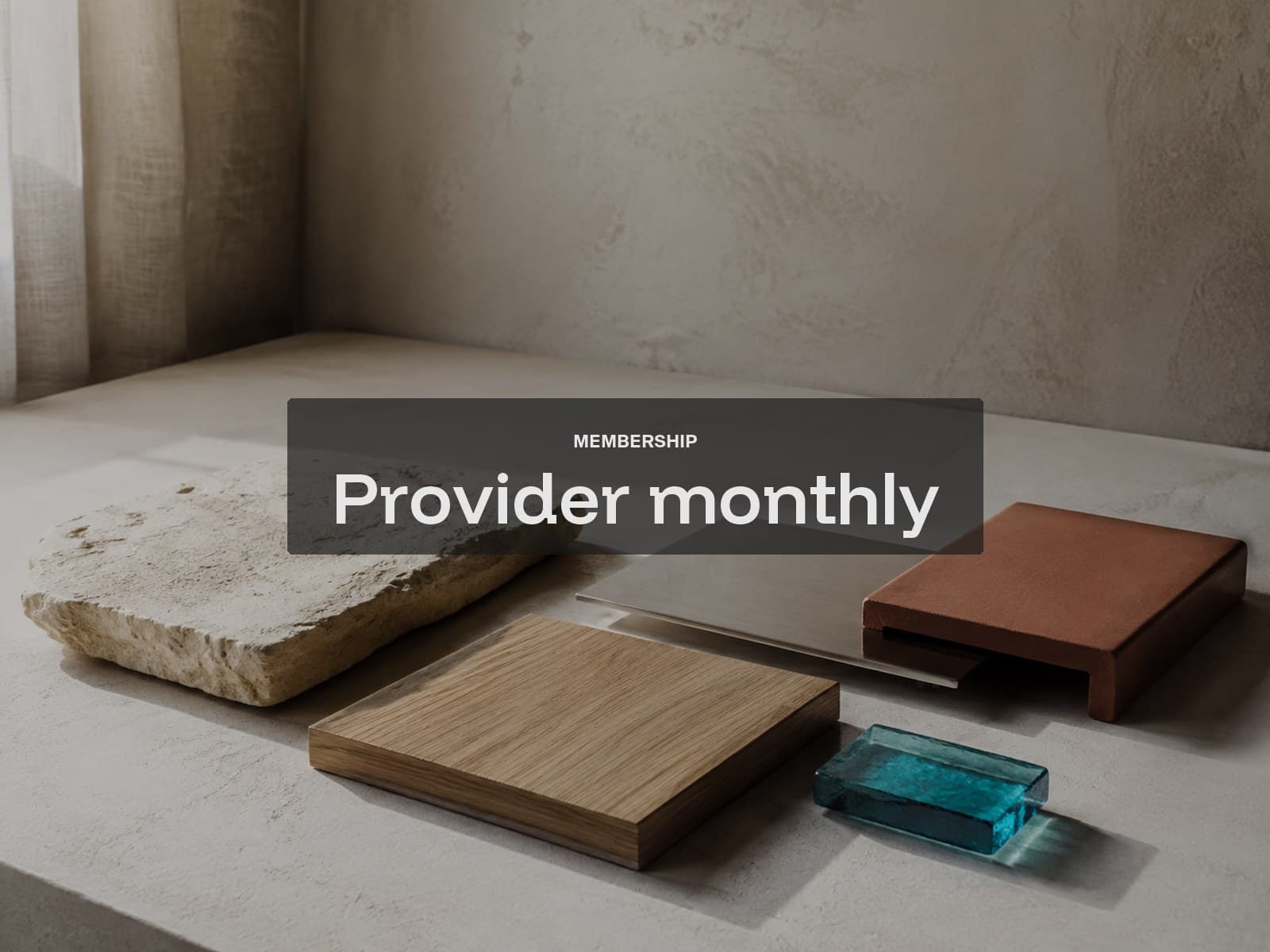 Provider monthly membership cover: stone, oak, steel and turquoise glass material samples.