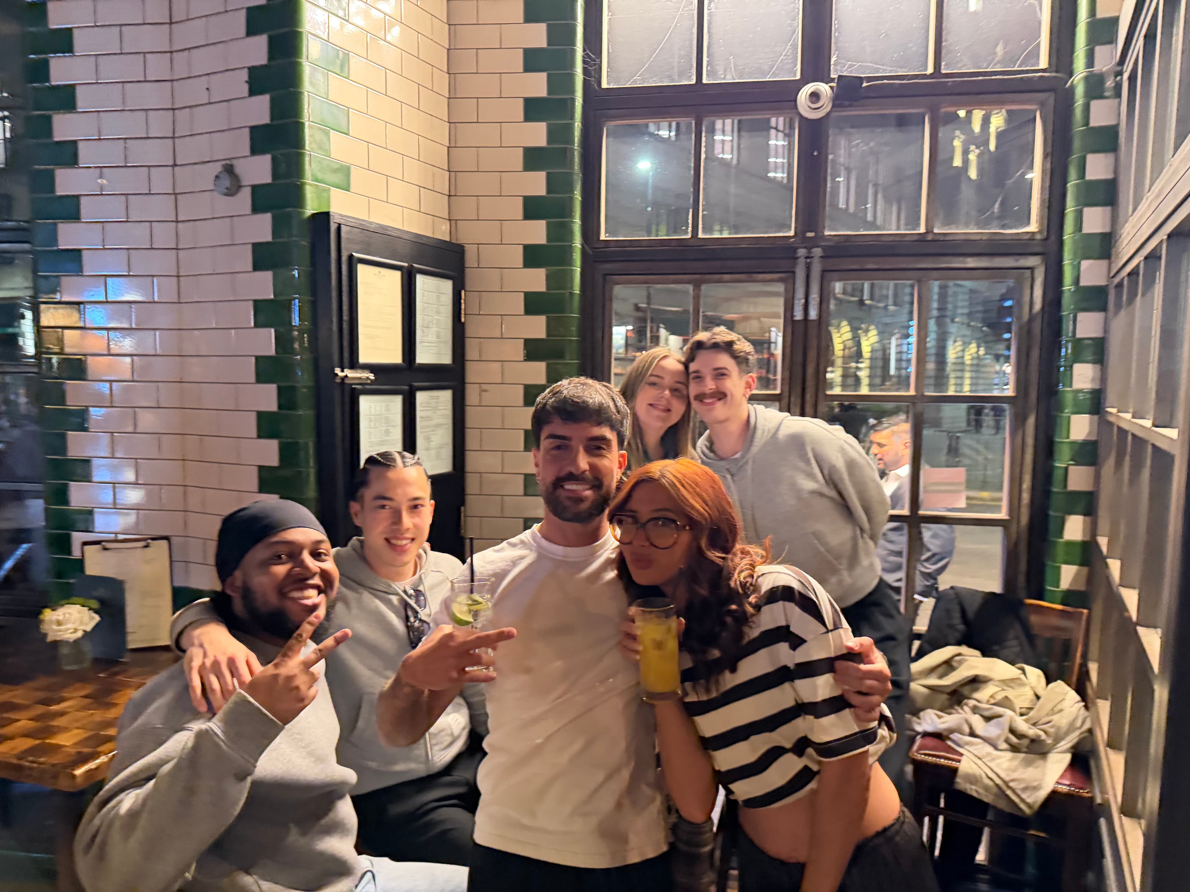 The Architecture Social team smiling together over drinks