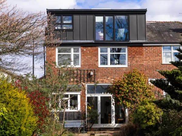 Rear elevation of Magda’s home, with the loft conversion above the original brickwork