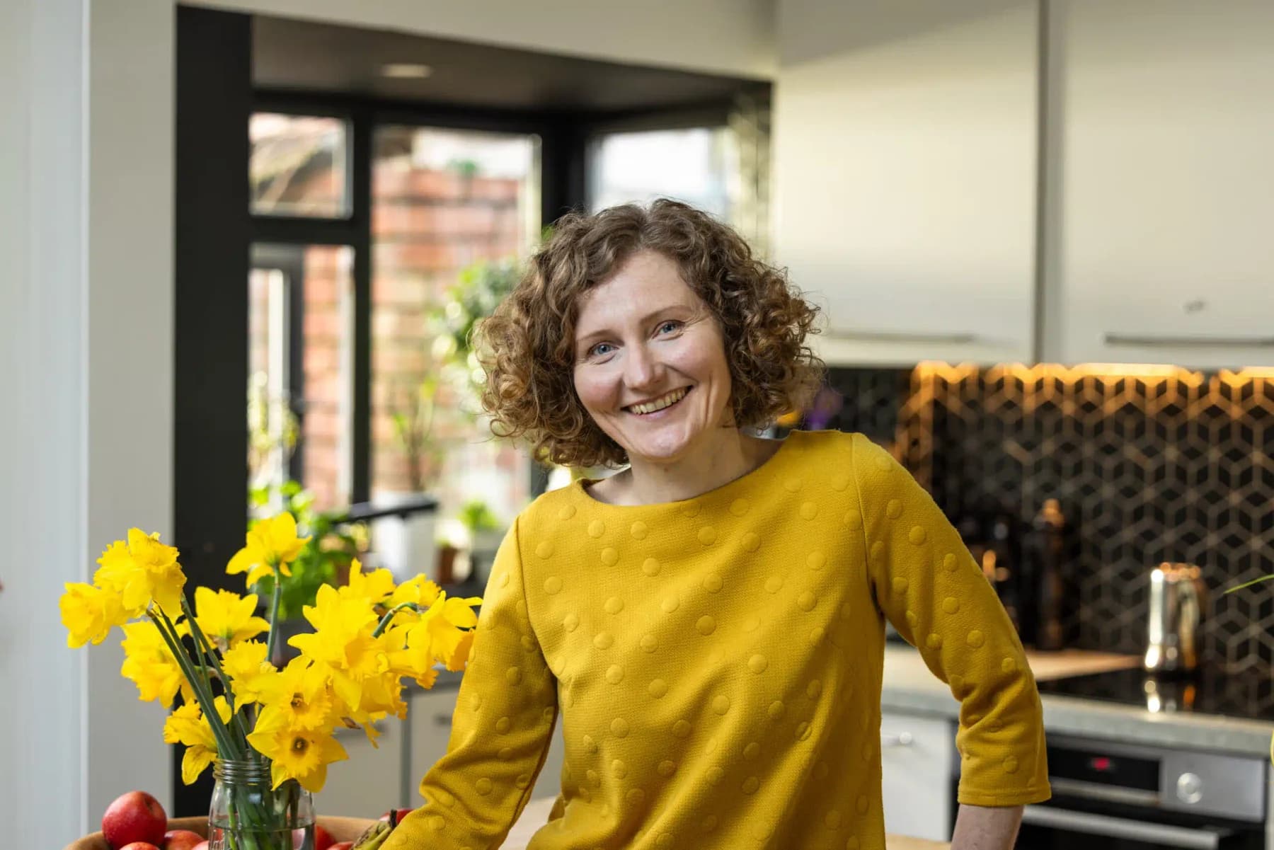 Architect Magda Haener in the kitchen of her renovated family home