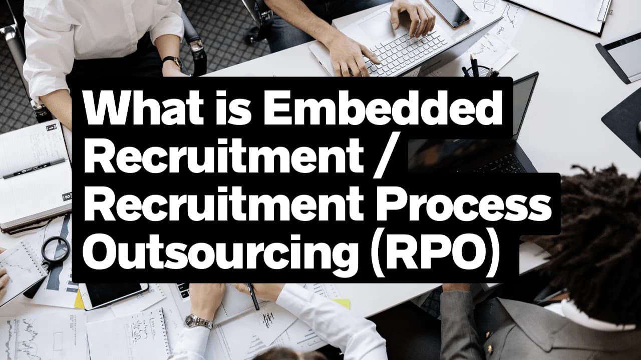 Collaborative Office Meeting Discussing Embedded Recruitment and RPO Strategies.