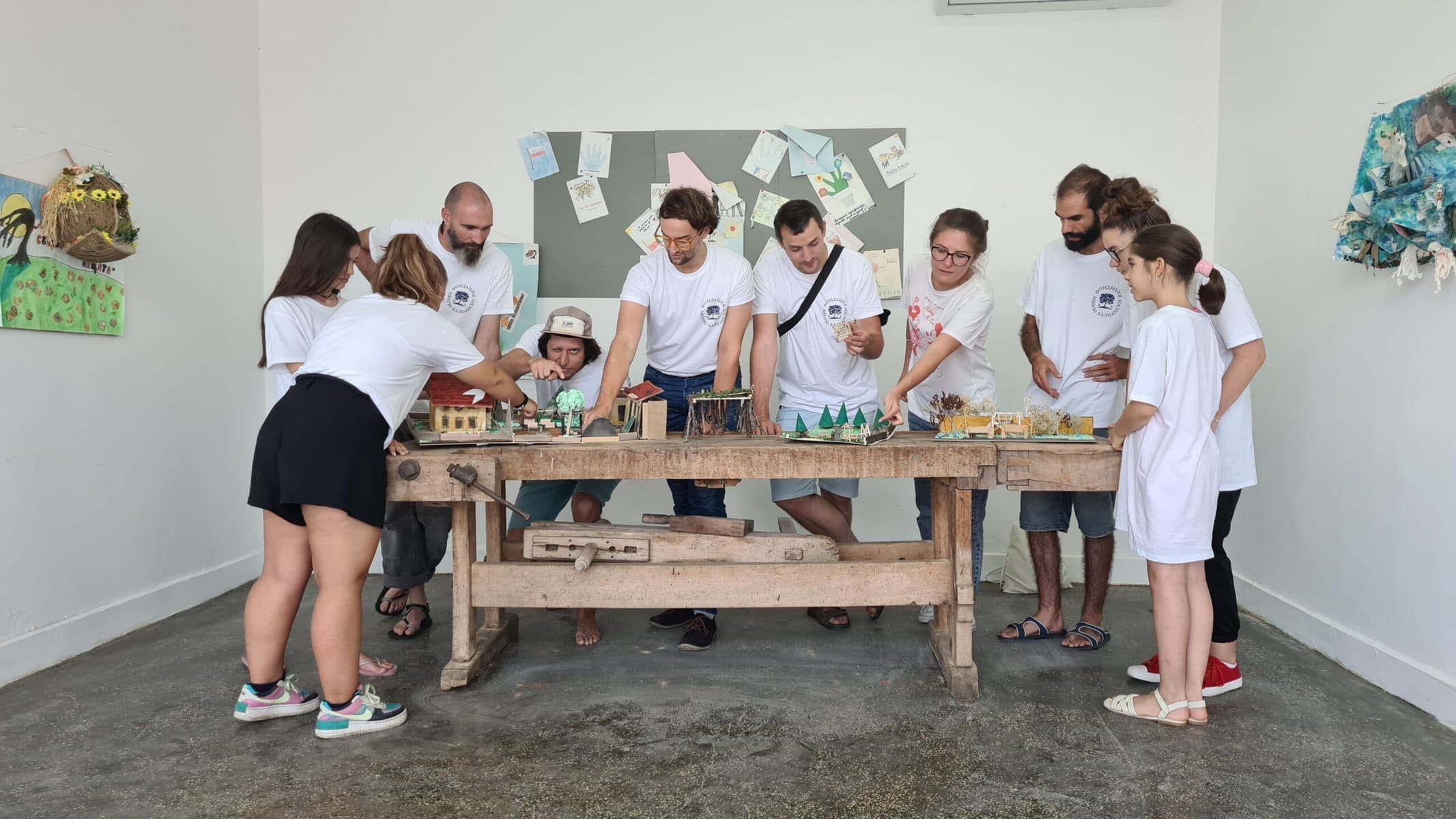 Engaging diverse group in urban planning with miniature models.
