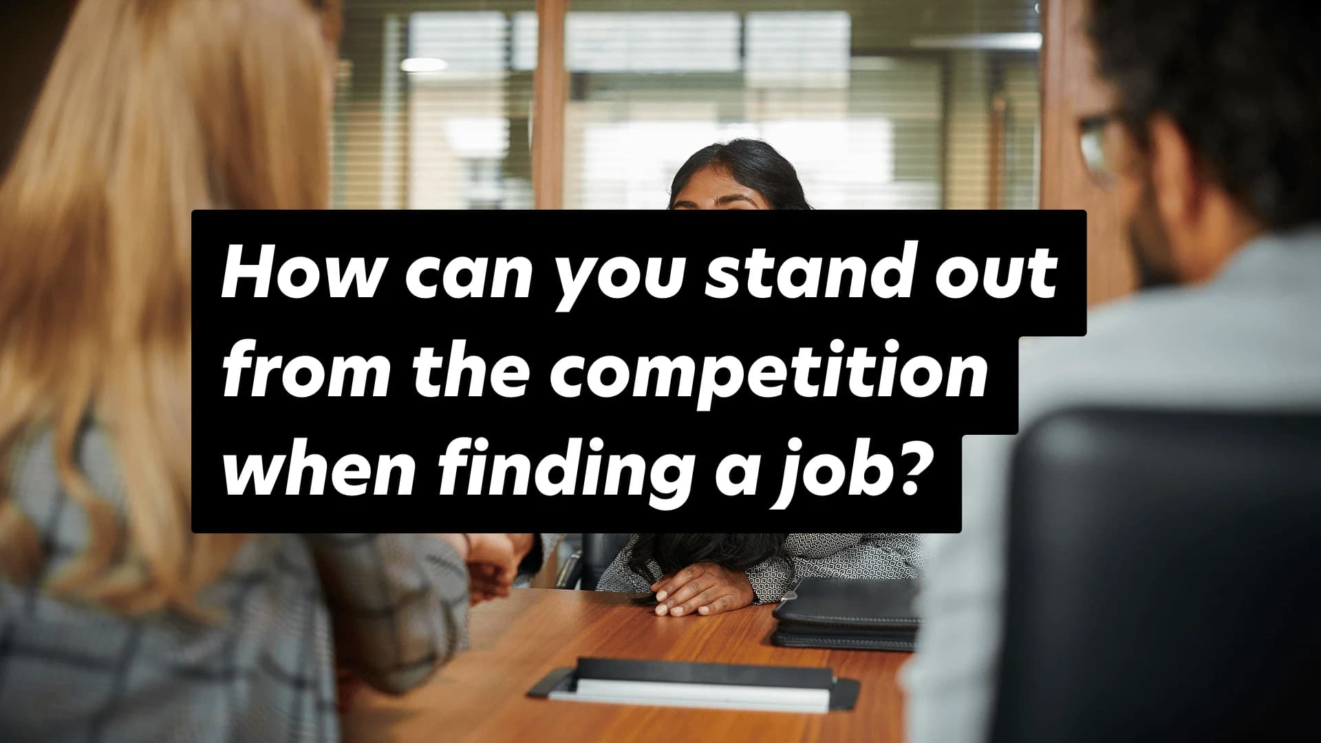 Interview tips: Stand out in architecture job searches. Professional setting with attentive interviewee.