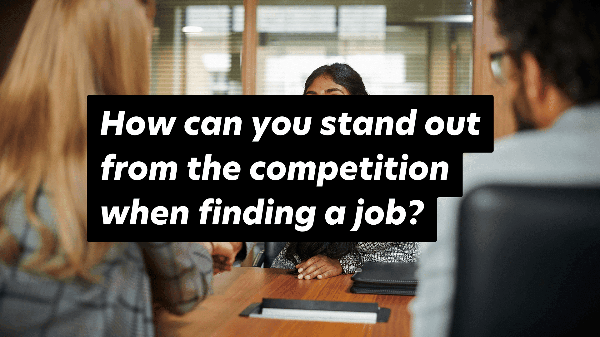 Interview tips: Stand out in architecture job searches. Professional setting with attentive interviewee.