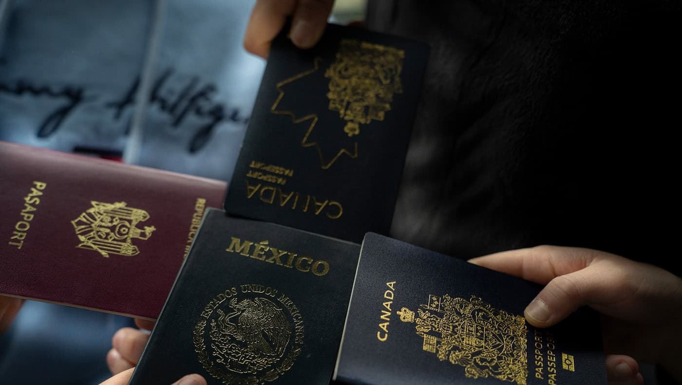 People holding passports and travel documents, used to illustrate right-to-work checks for EEA nationals.