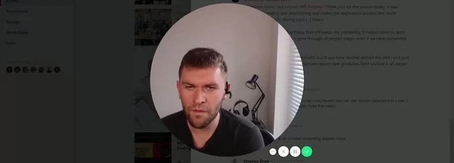 Man on a video call in a well-lit home office, appearing engaged and attentive.