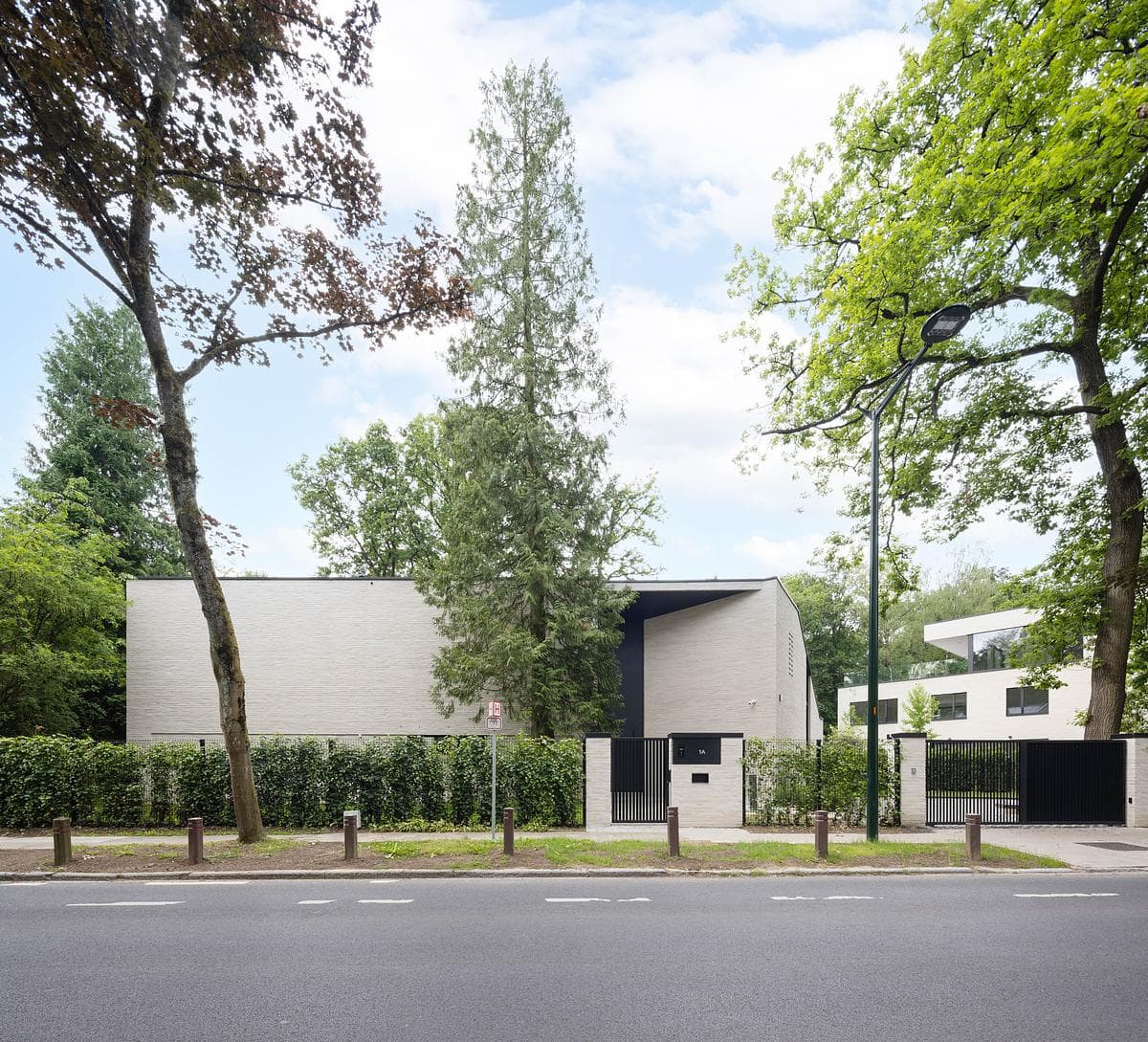 The villa’s street elevation is more enclosed than its garden side.