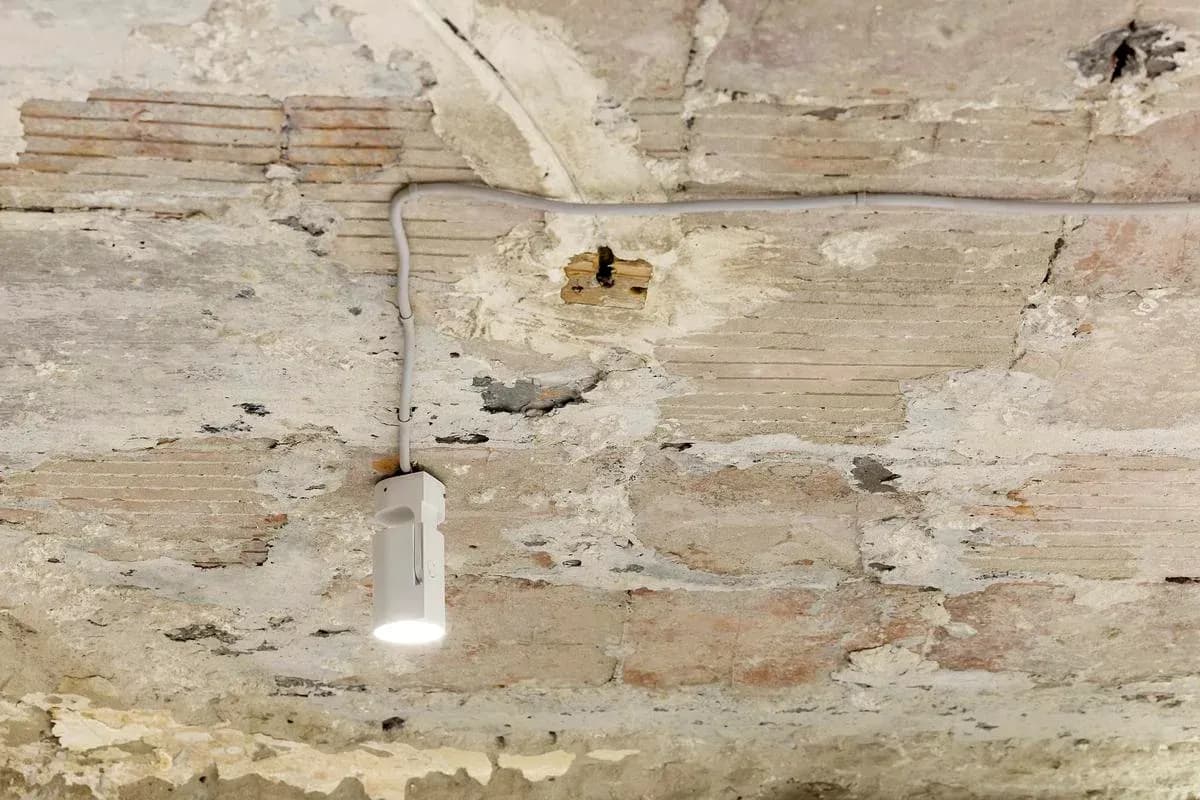 Traces of earlier finishes remain visible on the ceiling.