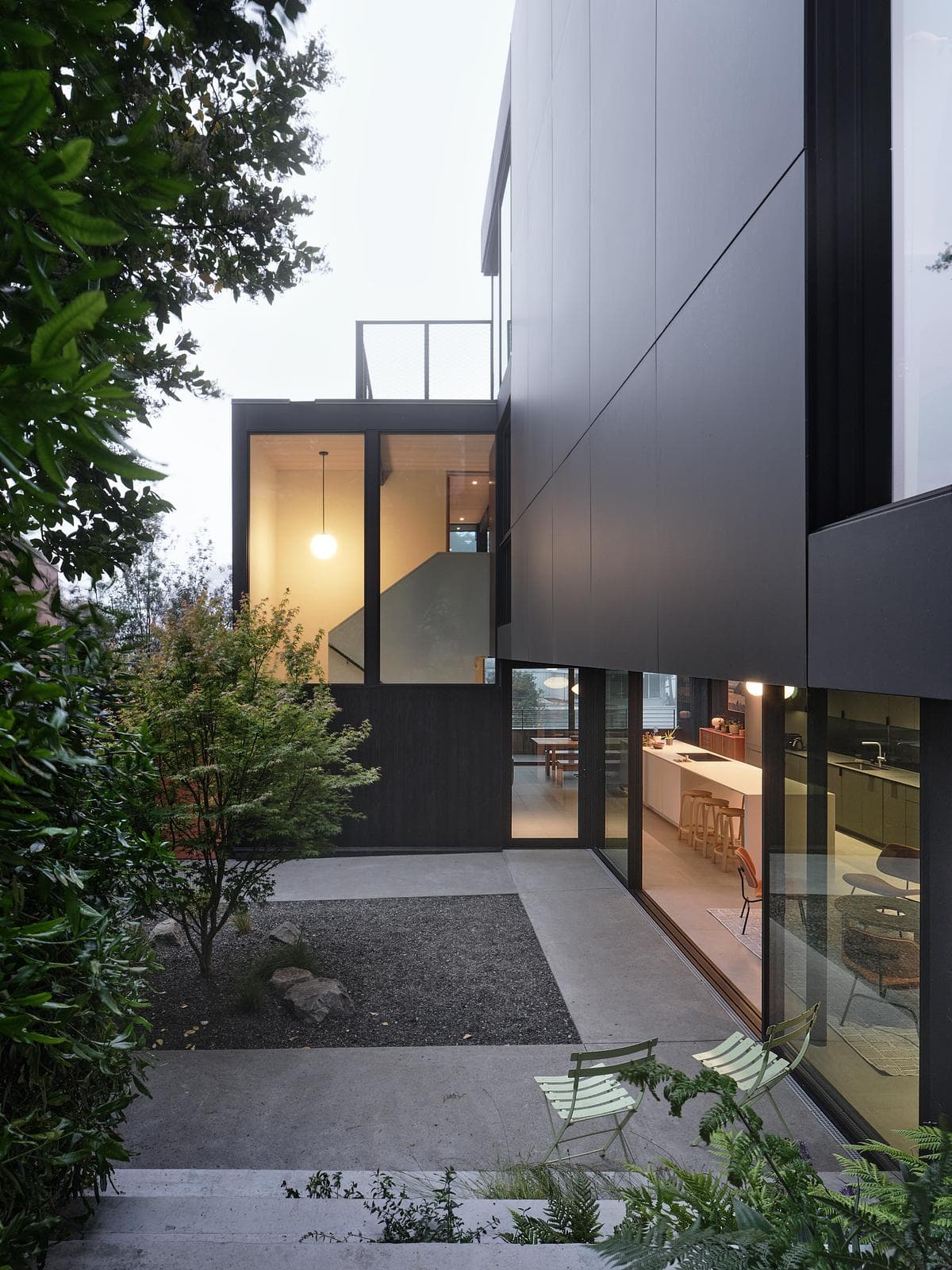 The house and garden are connected across several levels.
