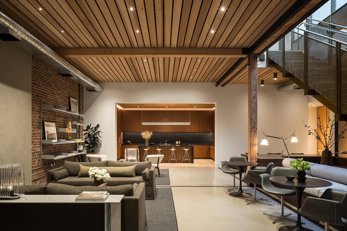 Brick, timber and planted interiors frame the gathering spaces.