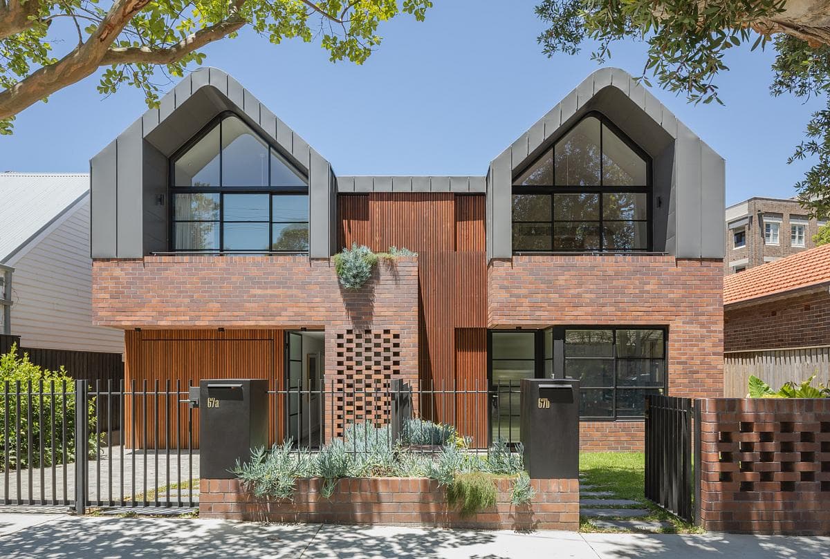 Two gabled forms give the attached homes distinct street-facing identities.