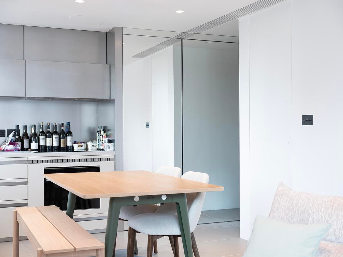 The dining area connects the fitted kitchen with the living space.
