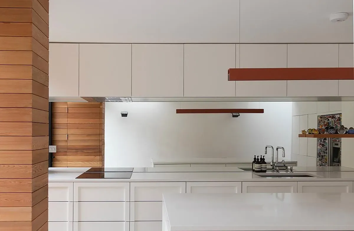 A mirrored splashback extends the view across the Diorama 2 kitchen.