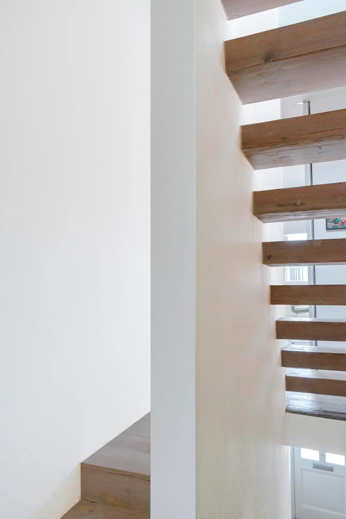 Open timber treads allow views through the new stair.