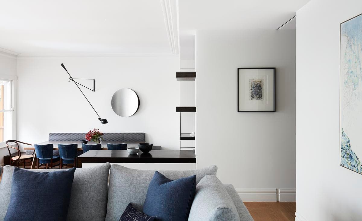 Hill Haven: living and dining spaces connected by a stepped timber floor.