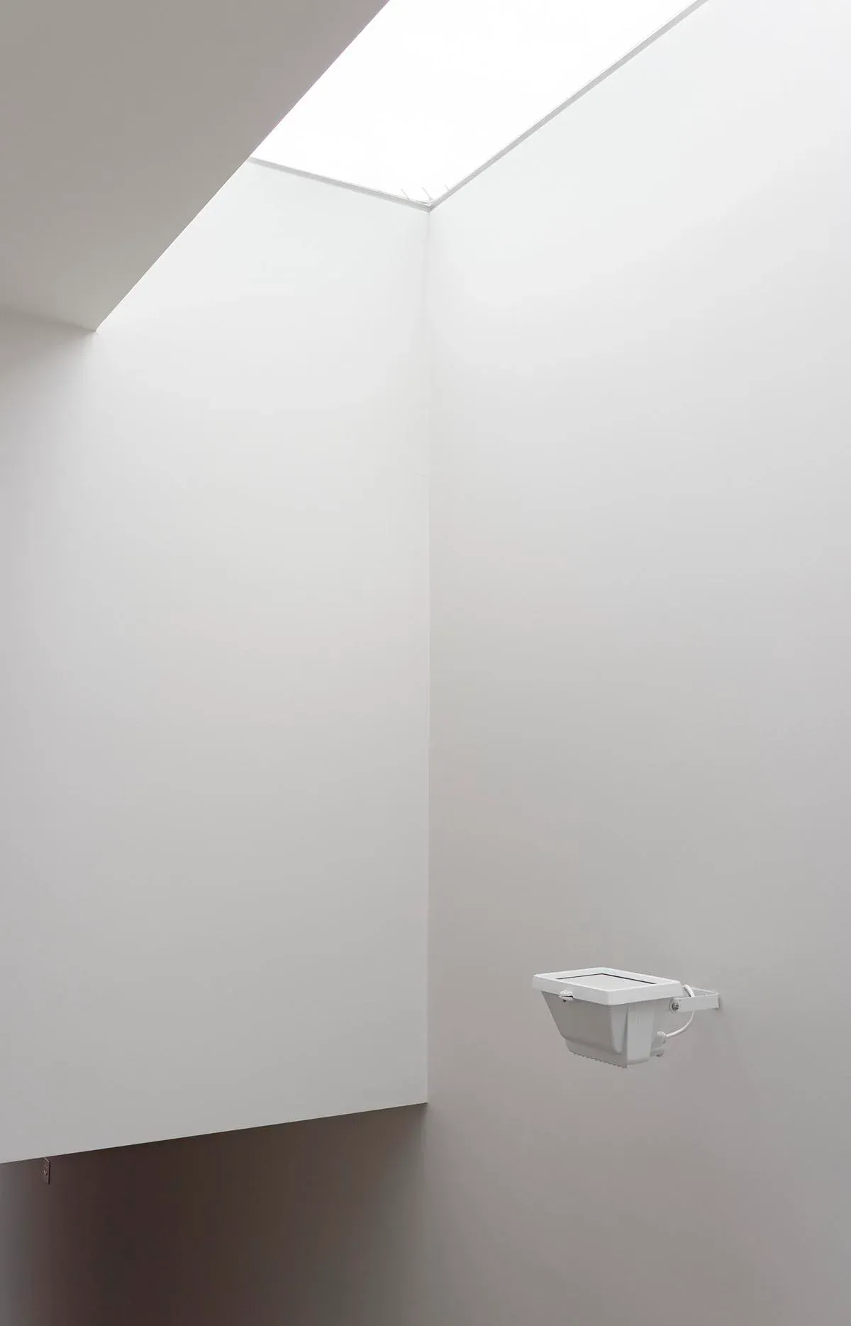 Daylight enters through the frameless rooflight.