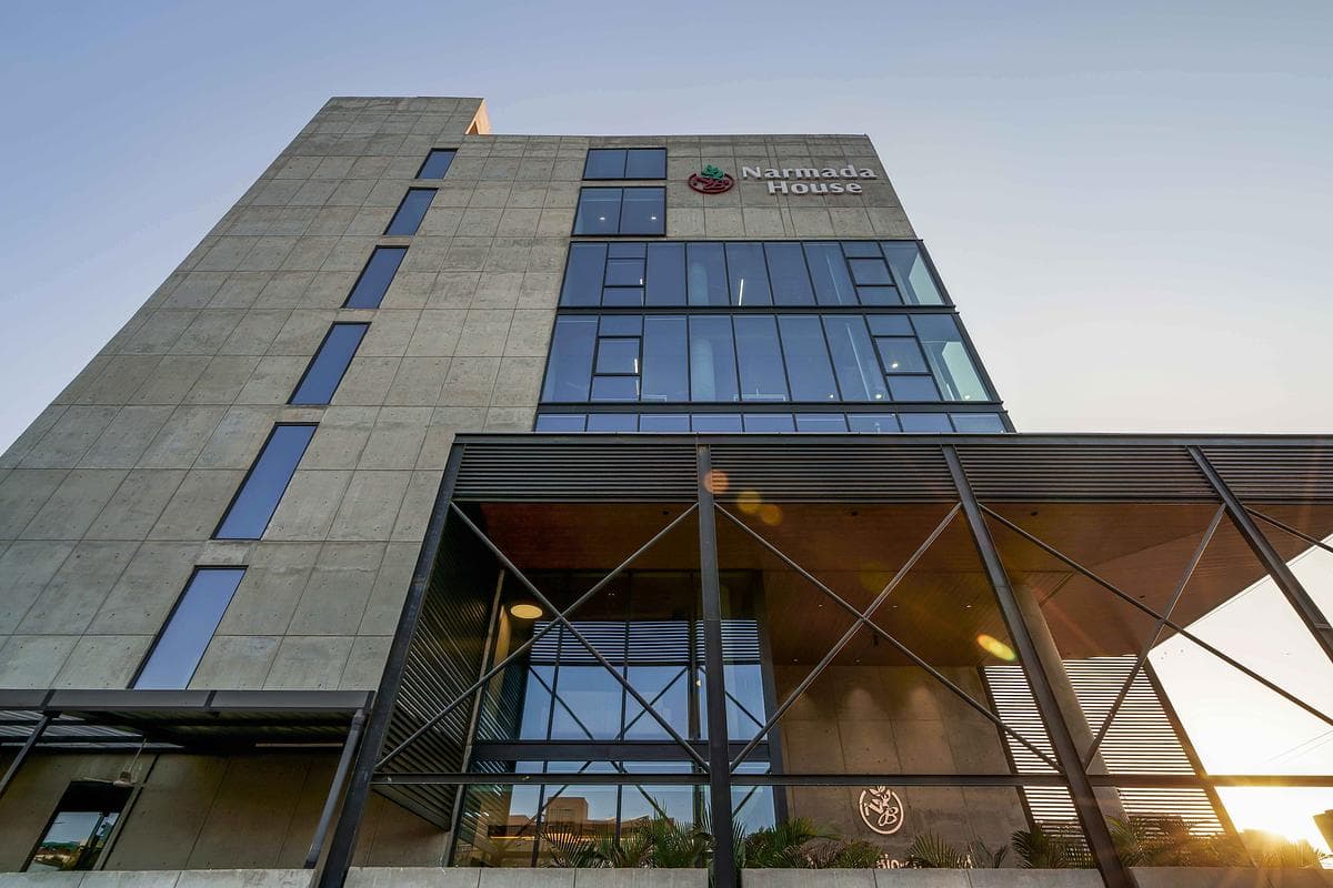 Concrete and glazing frame the headquarters entrance.