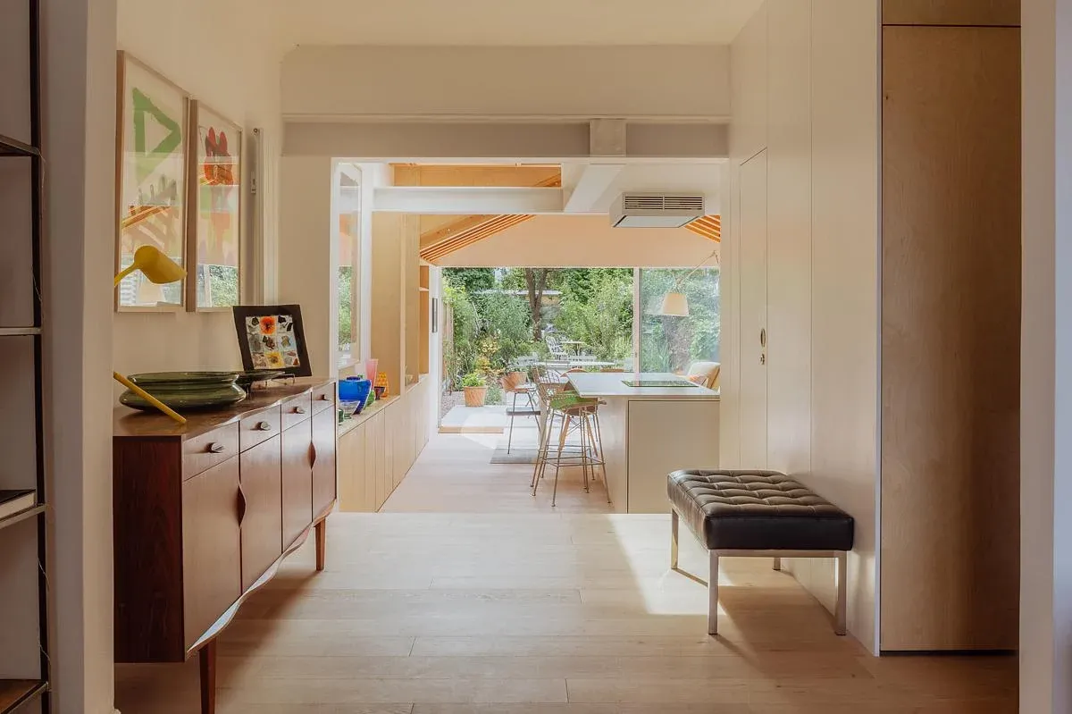 The retained front room leads through to the brighter rear living space.