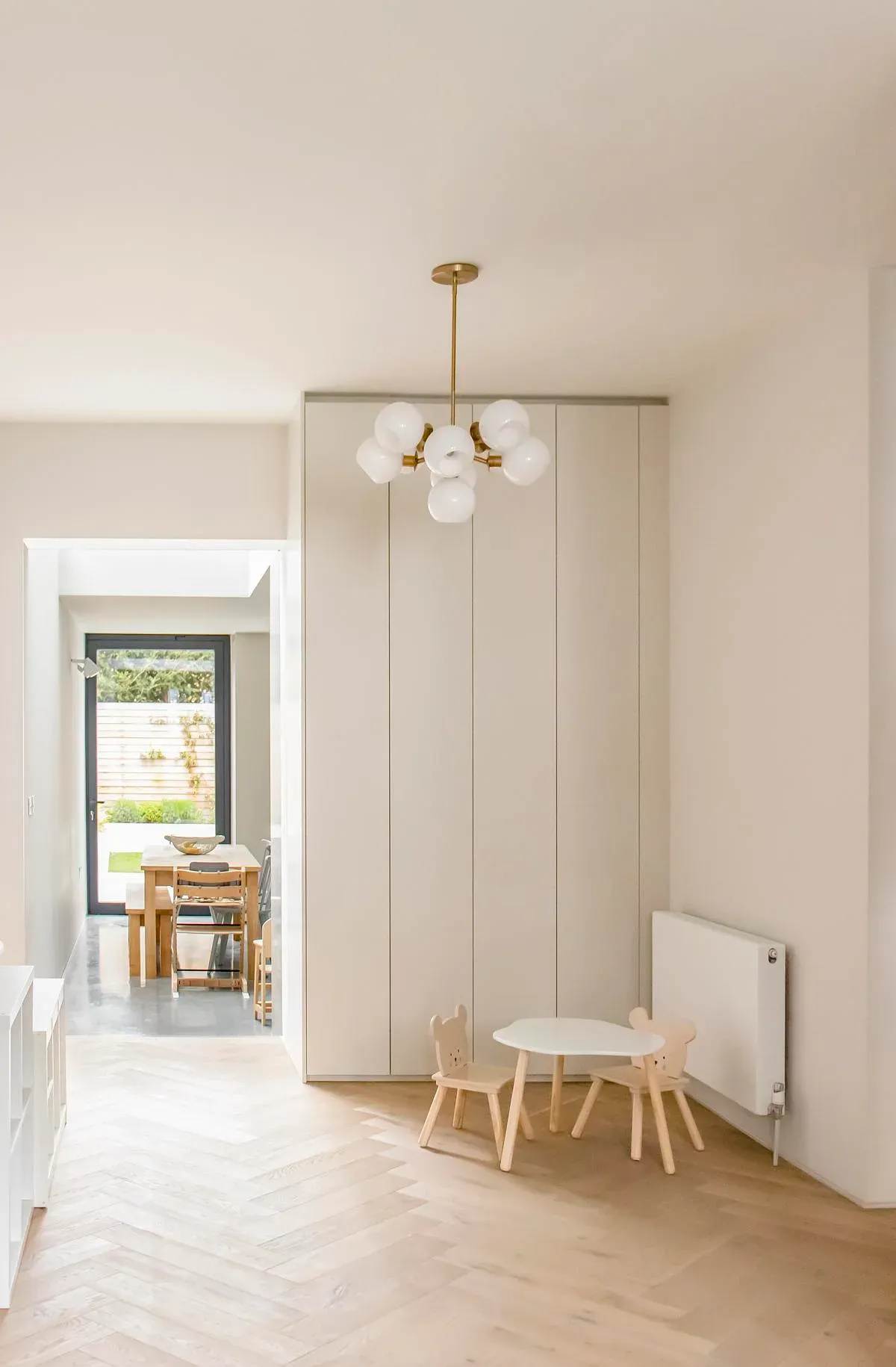 An opening links the front room to the kitchen and garden beyond.