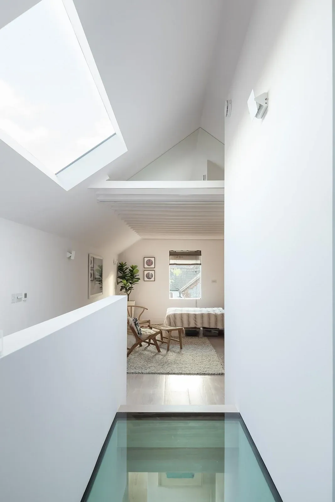 Glass floor and rooflight above the upper-level circulation space.
