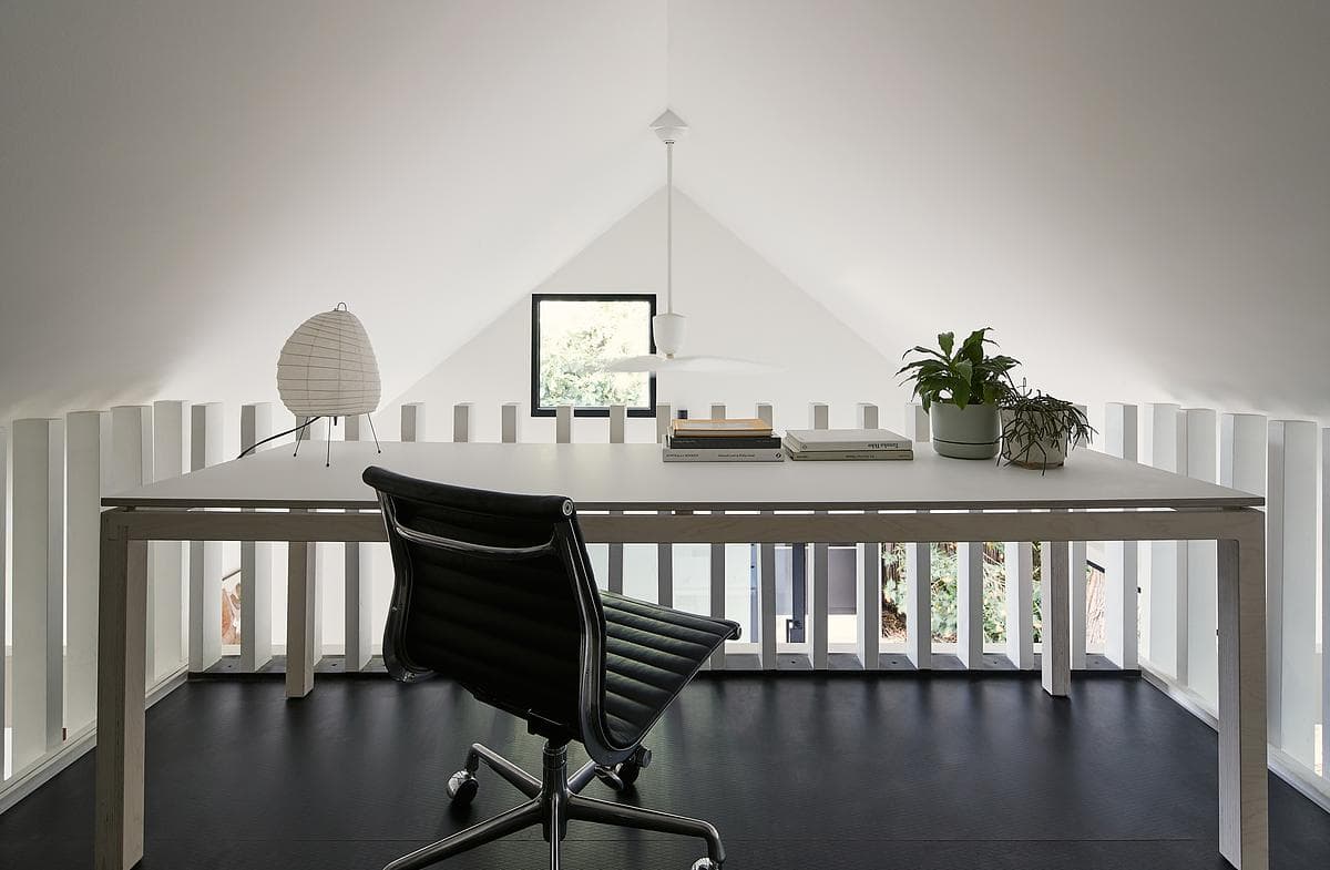 The upper workspace sits beneath the pitched roof.