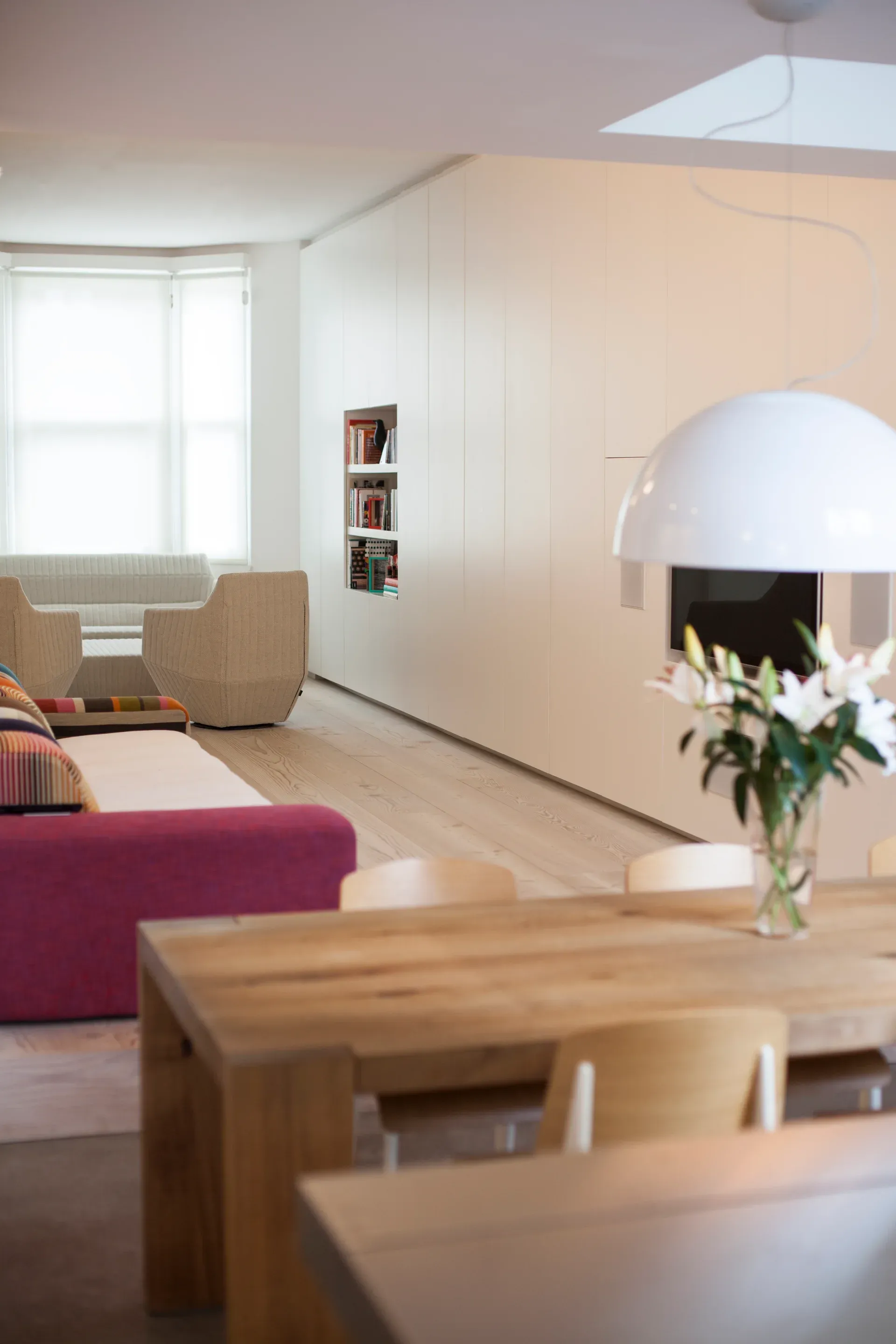 White planes define the living space while maintaining views through the ground floor.