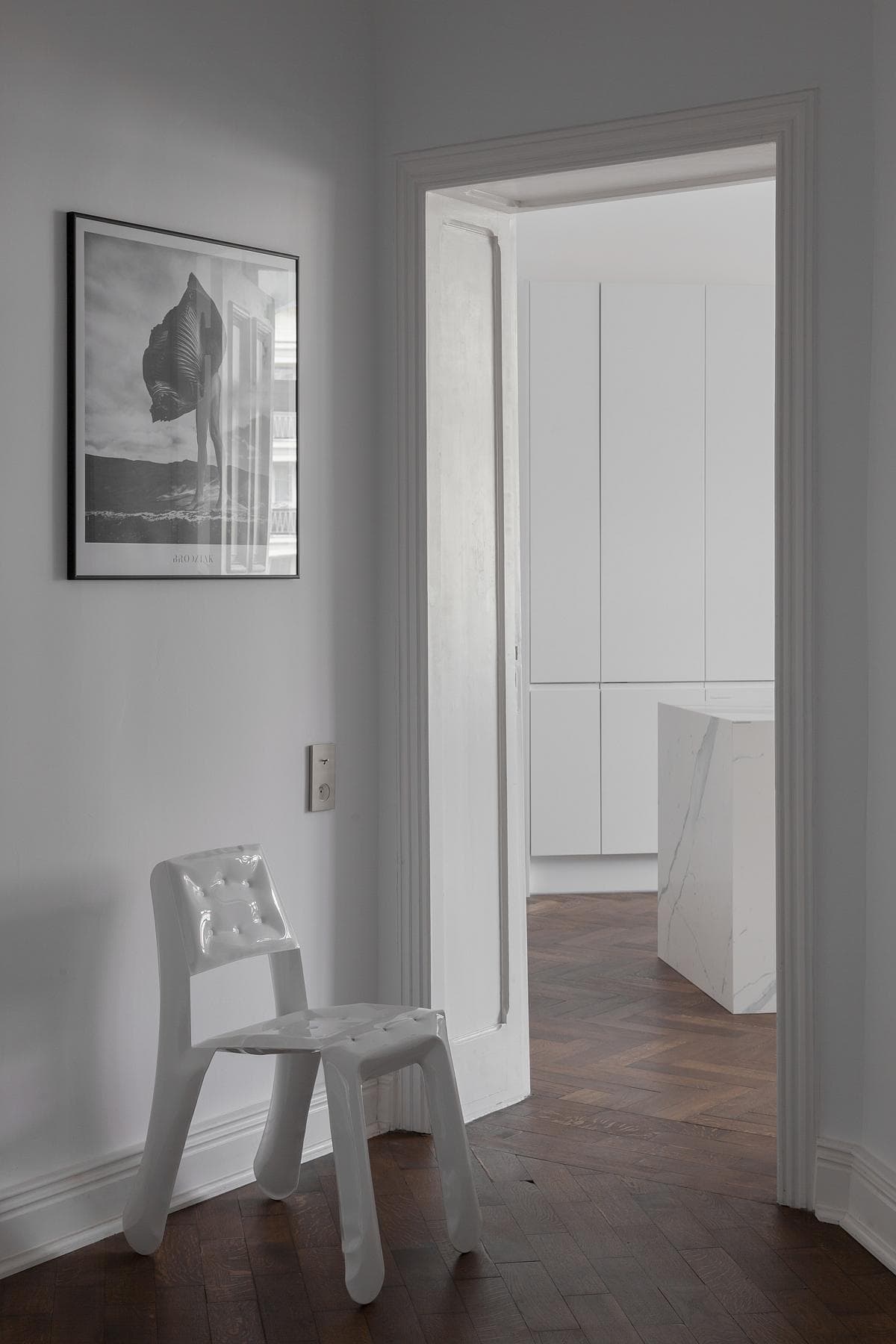 Historic doorways frame contemporary furniture and artwork.
