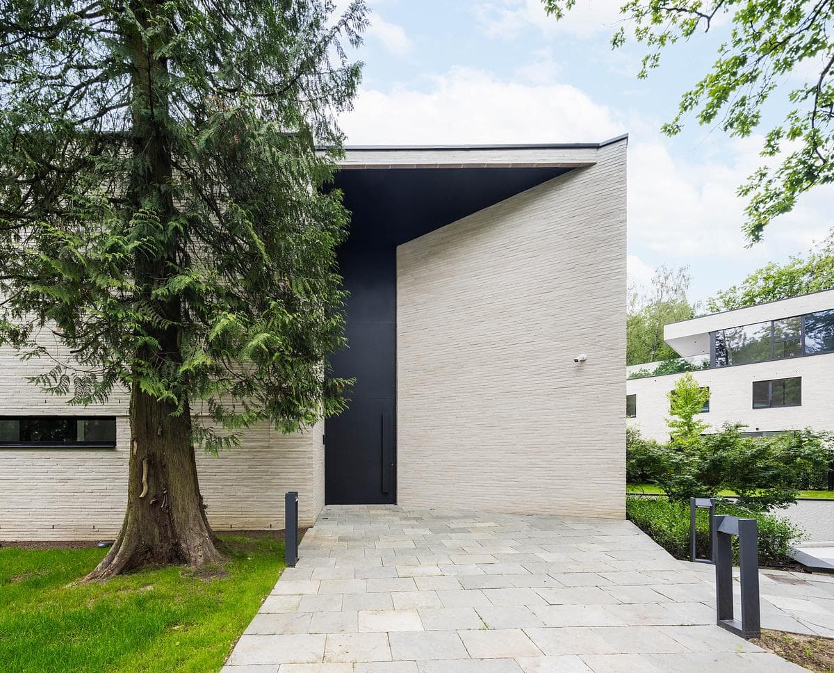 A recessed entrance cuts into the brick street frontage.
