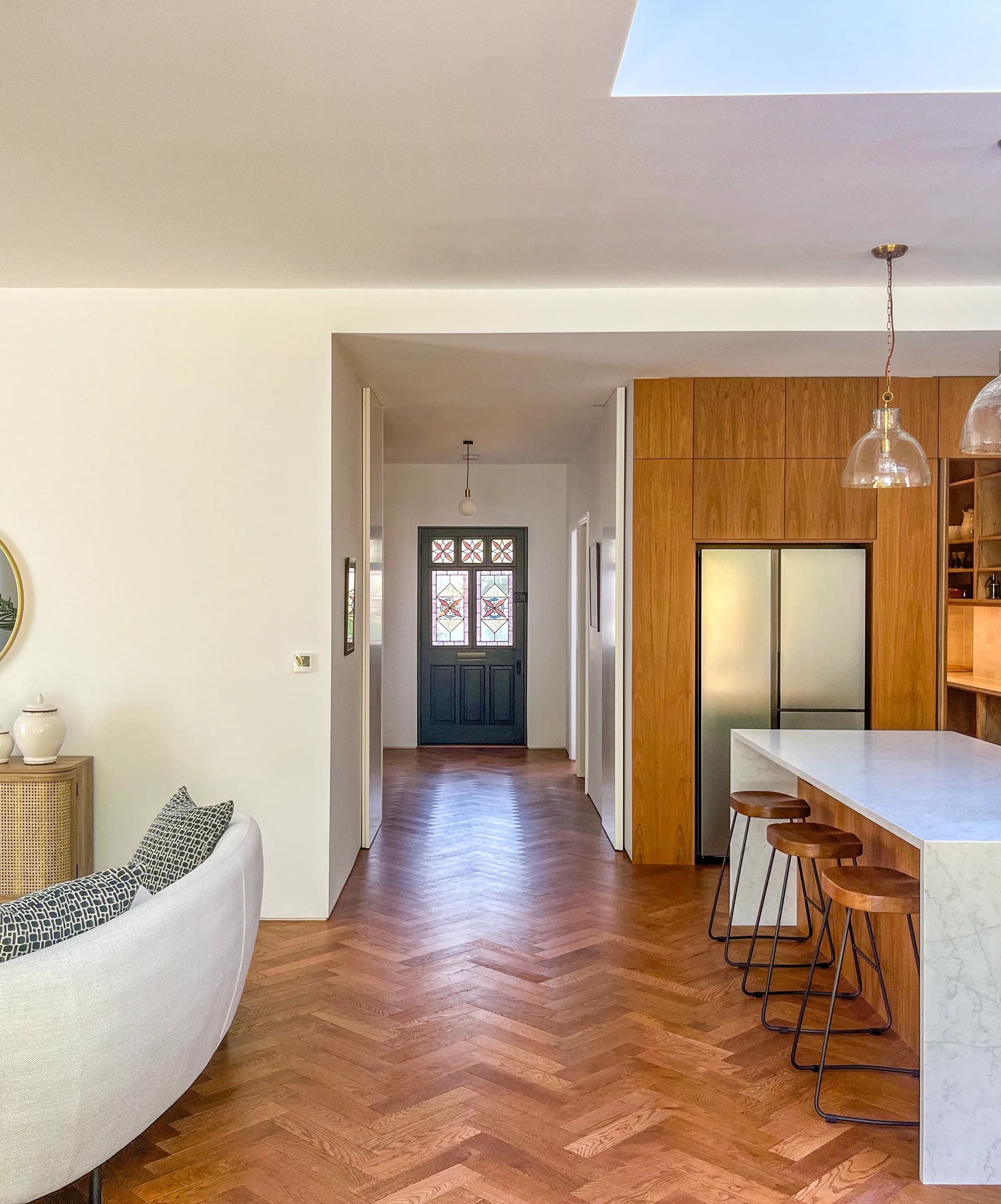 The open ground floor maintains a view towards the original front door.