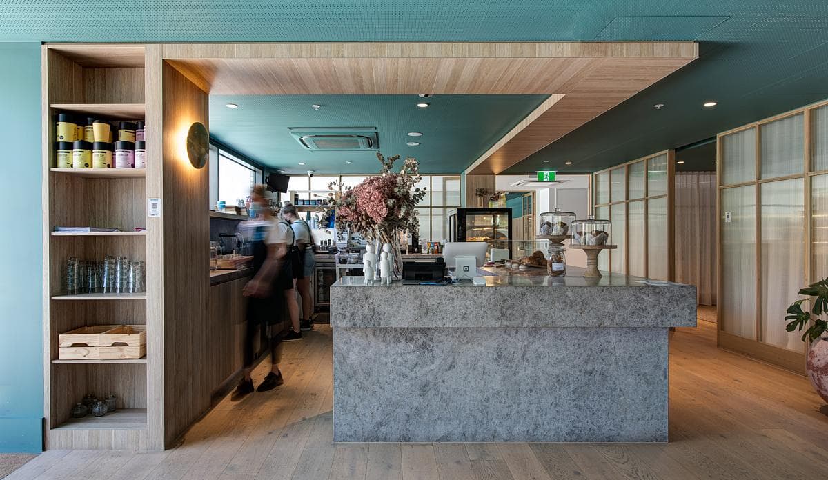 The providore counter sits beside shelves of everyday provisions.