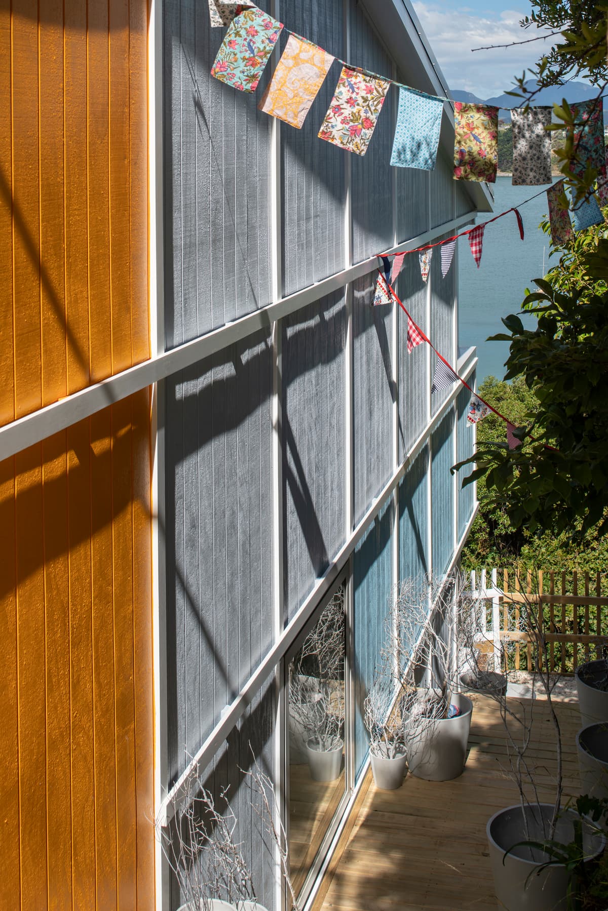 Steps beside the house connect with a shared garden.