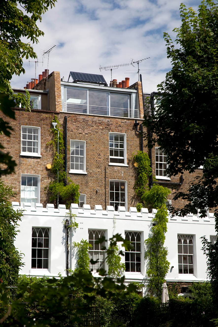 The listed canal-side house with its glazed rooftop addition
