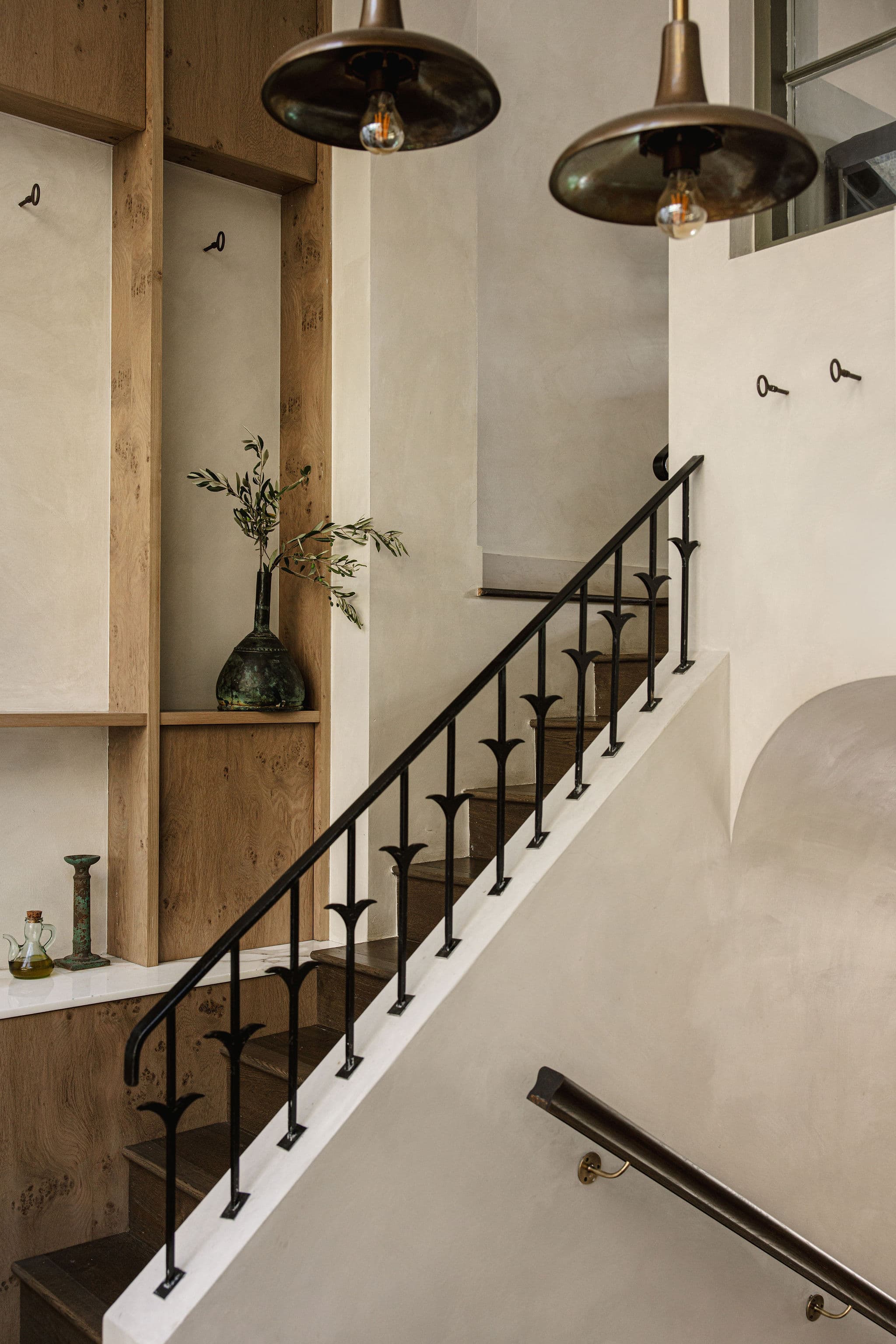 The stair connects the dining rooms within the townhouse.