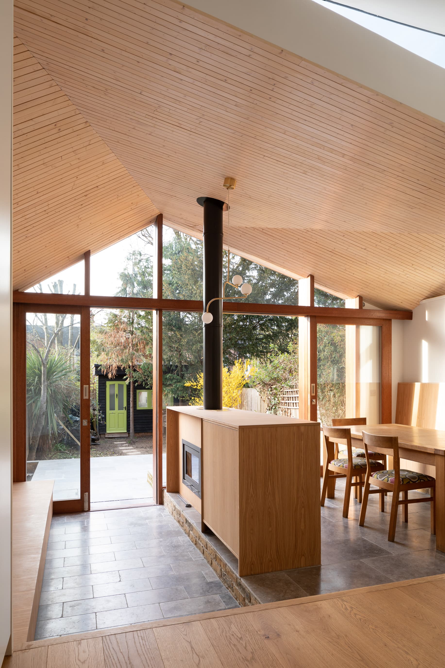 Changing light falls across the timber-lined ceiling.