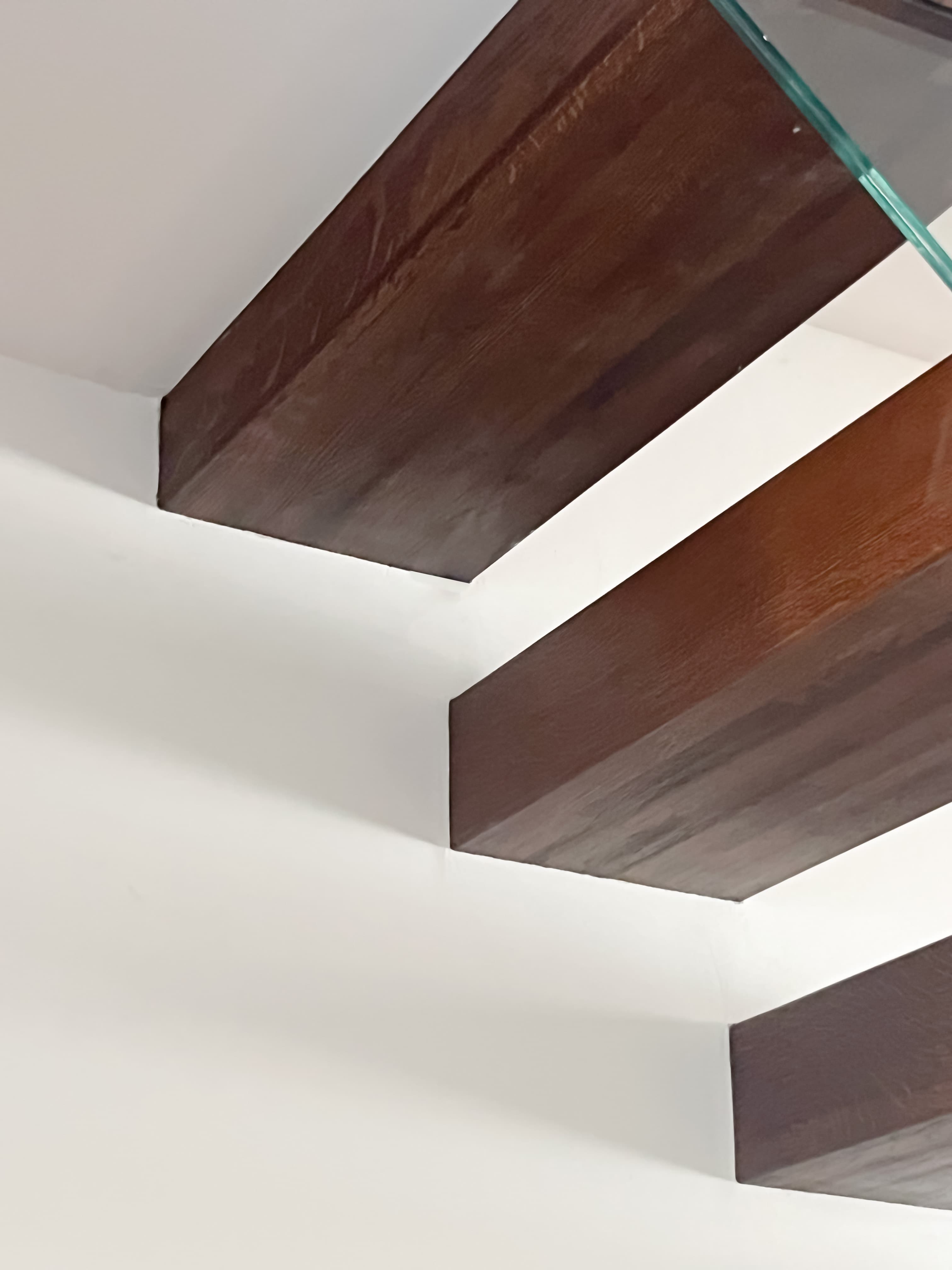 Timber joinery and a rooflight articulate the stair.