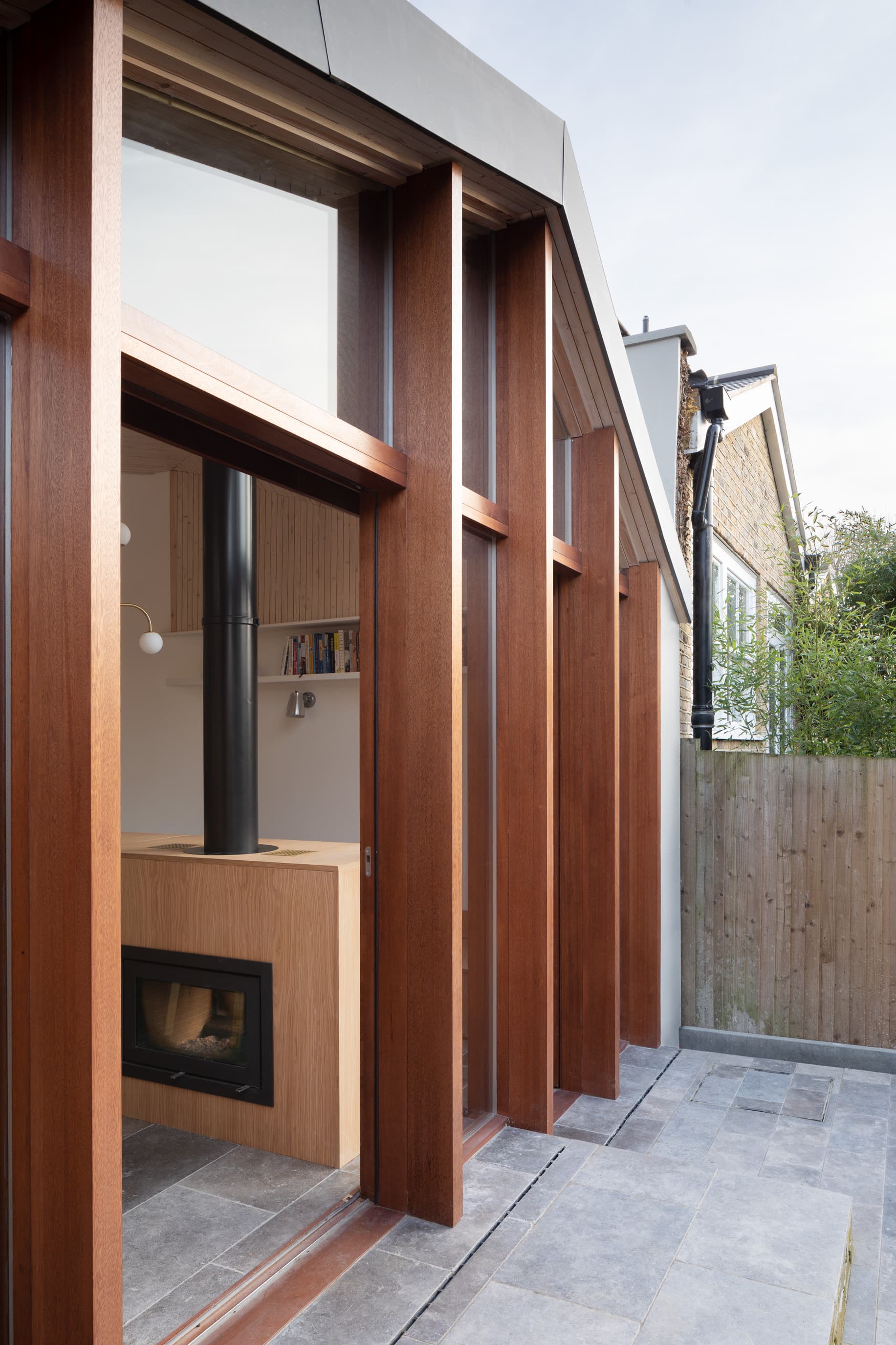 Deep timber frames give the garden elevation depth.