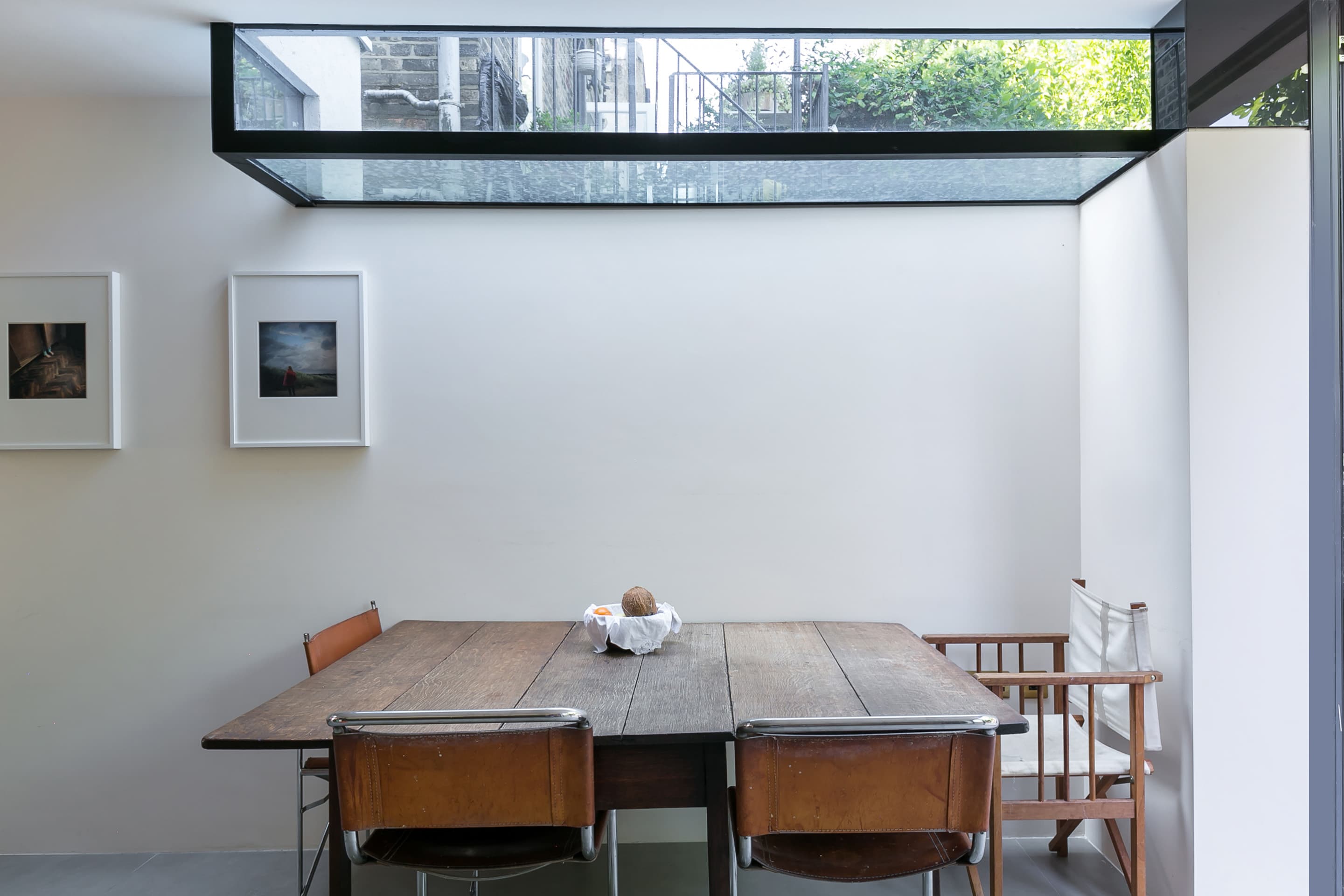 An inverted box rooflight defines the dining area.