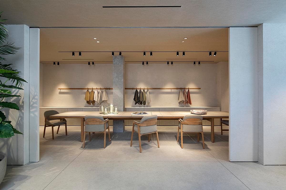 A quieter display area presents tables and lighting against textured finishes.