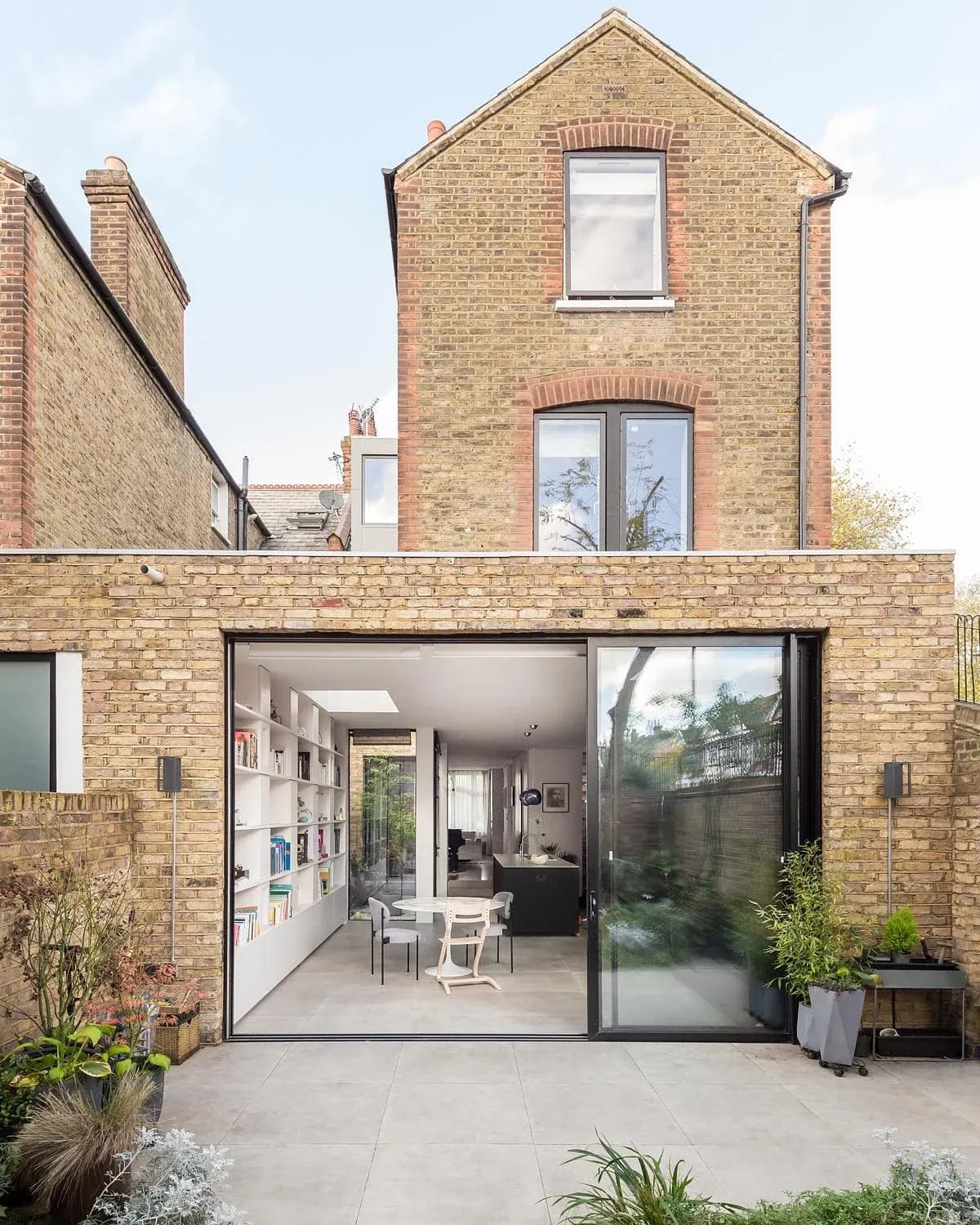 Rear brick elevation and glazed ground-floor extension at Courtyard Terrace.